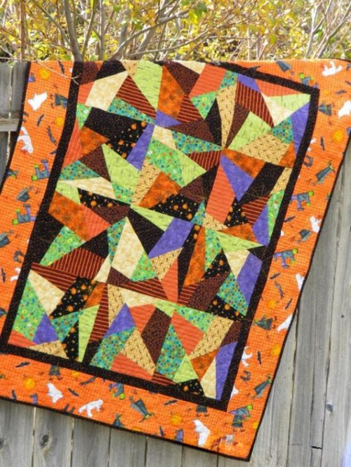 Shadowy Figures Quilted Blanket